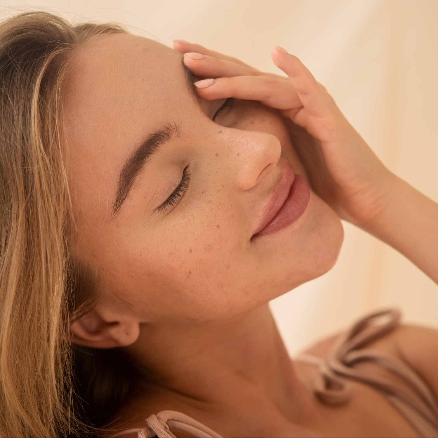 Woman touching her face 